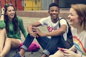 file-20181119-76157-1up435y Boy smiling with friends