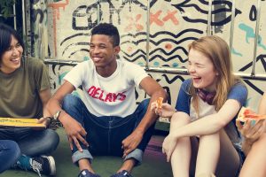 getting-feedback-from-your-church-youth-group Boy and girl laughing with friends