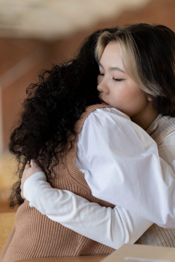 Two women hugging eachother