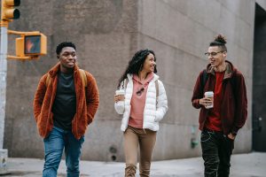 Group of teenagers walking across the street