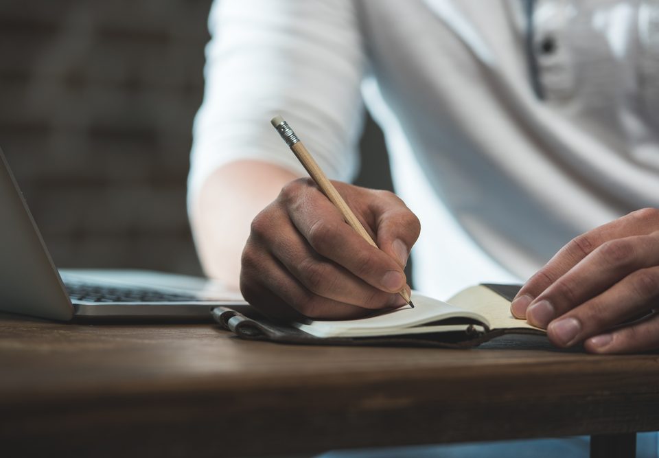 Man writing on paper