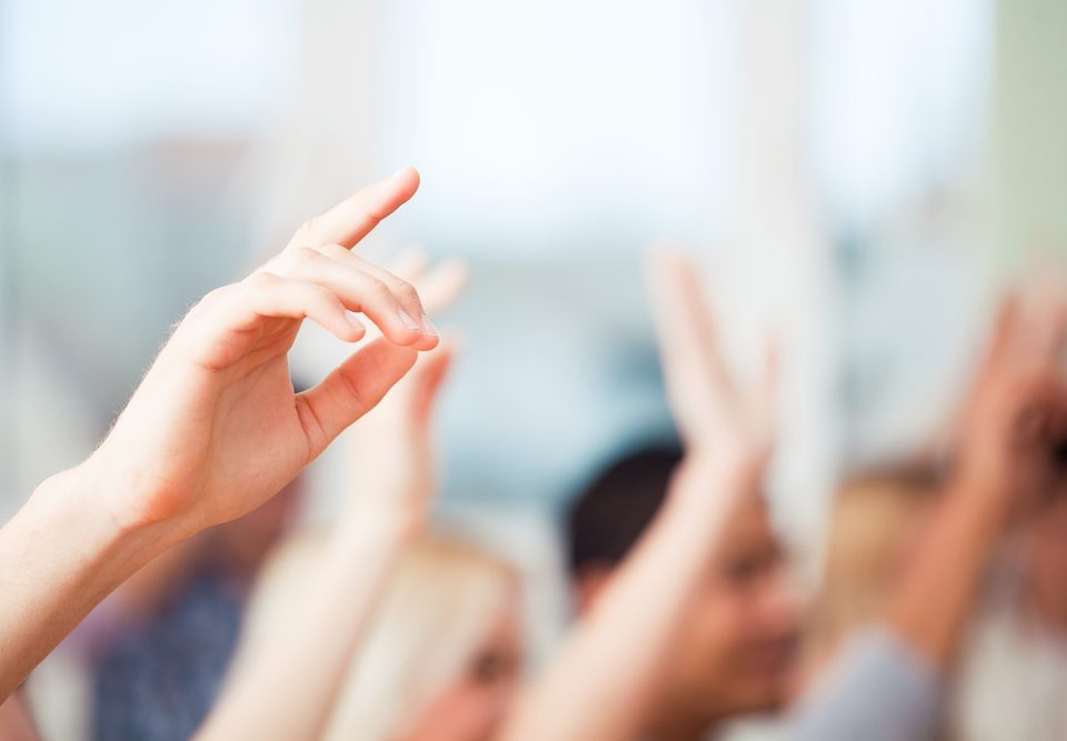 Children with their hands up